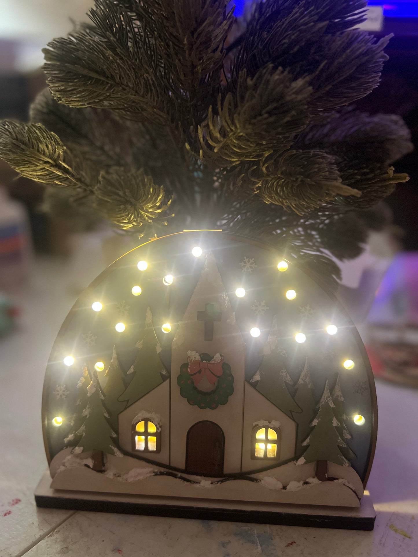 Snowy church with lights shelf sitter.