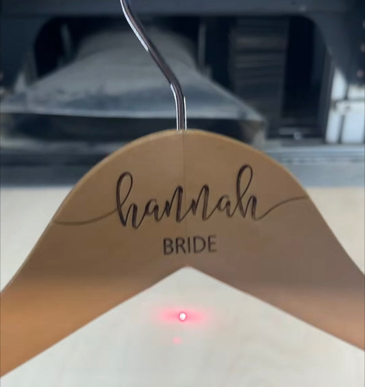 Wooden hanger with custom engraved name