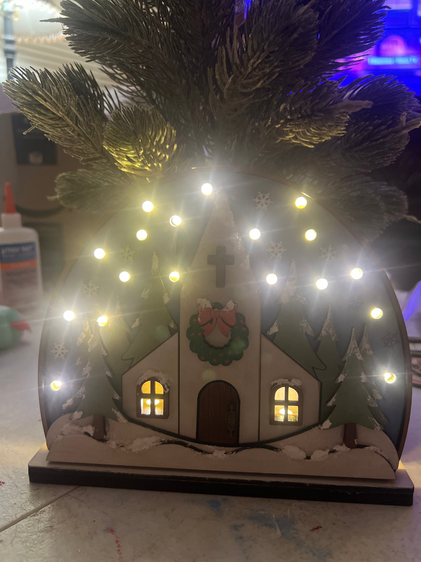 Snowy church with lights shelf sitter.