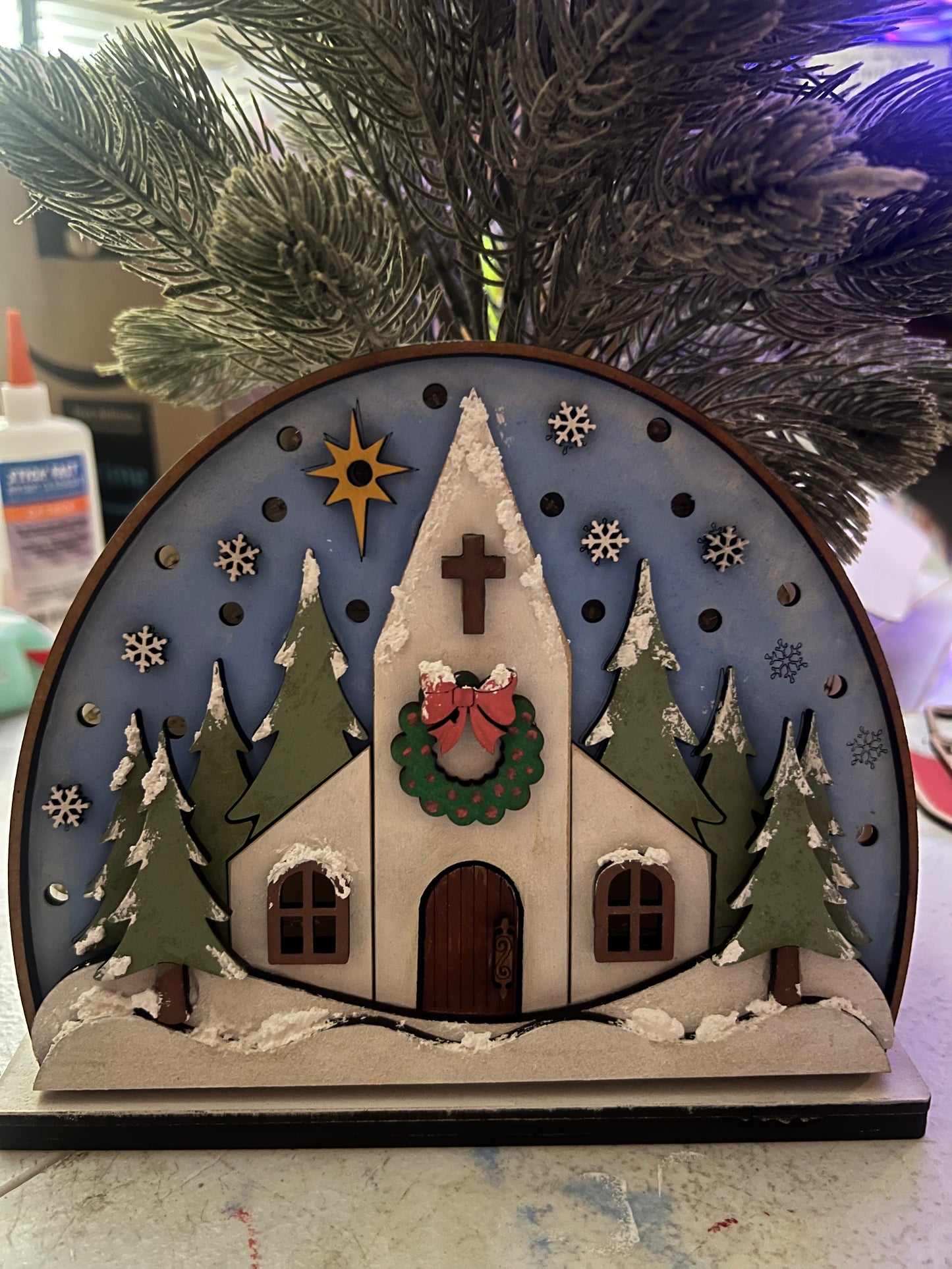 Snowy church with lights shelf sitter.